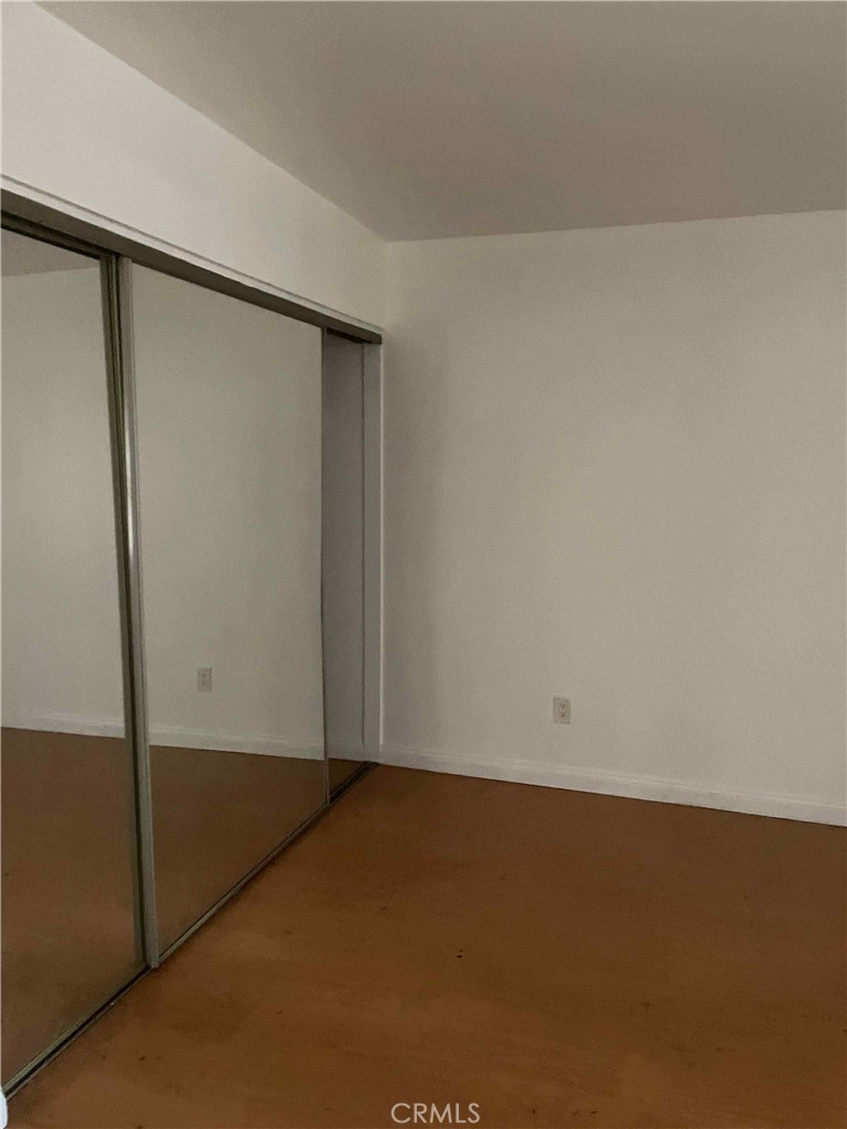 1315 Massachusetts Avenue, Unit 101 Riverside, CA 92507 - Photo 6 of 11 an empty room with a door
