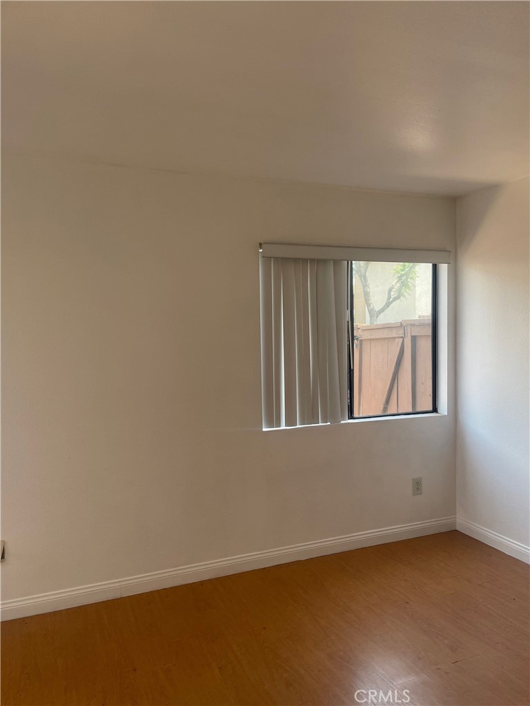 1315 Massachusetts Avenue, Unit 101 Riverside, CA 92507 - Photo 7 of 11 an empty room with a window