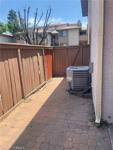 a white toilet sitting next to a bath tub