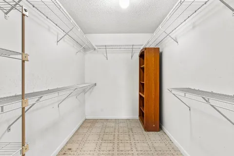 a view of walk in closet with window