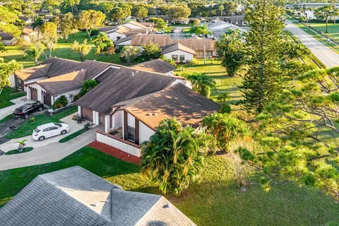 a aerial view of a house with swimming pool and garden