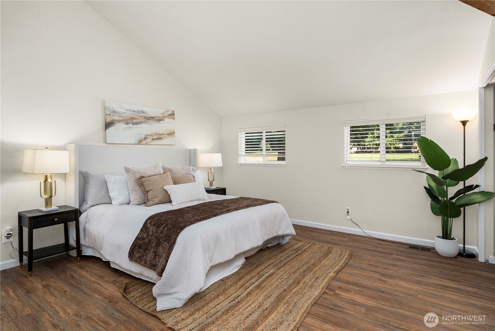 31611 37th Avenue Southwest Federal Way, WA 98023 - Photo 13 of 34 a bedroom with a bed and wooden floor