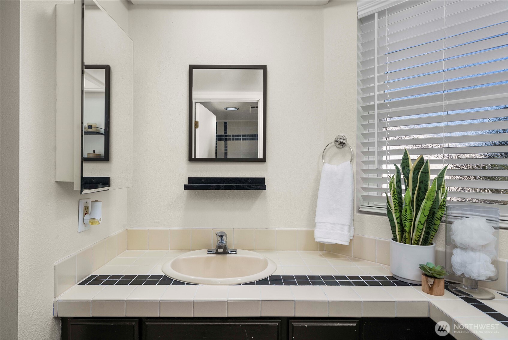 31611 37th Avenue Southwest Federal Way, WA 98023 - Photo 16 of 34 a bathroom with a granite countertop sink and a mirror