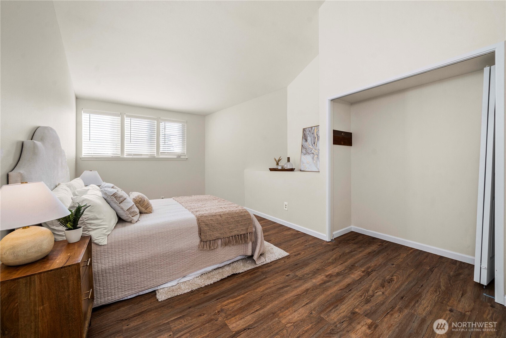 31611 37th Avenue Southwest Federal Way, WA 98023 - Photo 18 of 34 a bedroom with a bed and wooden floor