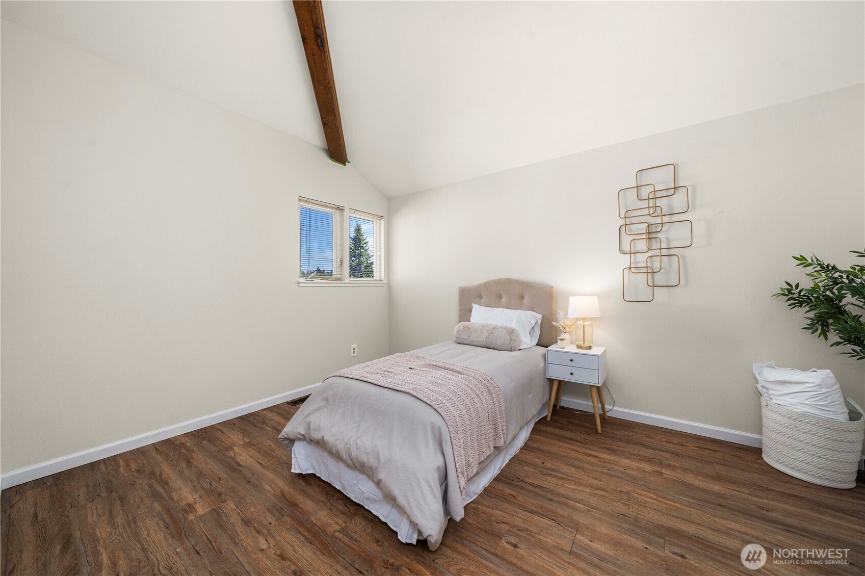 31611 37th Avenue Southwest Federal Way, WA 98023 - Photo 21 of 34 a bedroom with a bed and a potted plant