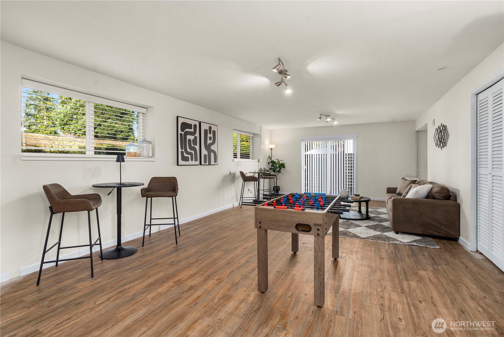 31611 37th Avenue Southwest Federal Way, WA 98023 - Photo 23 of 34 a living room with furniture and a wooden floor