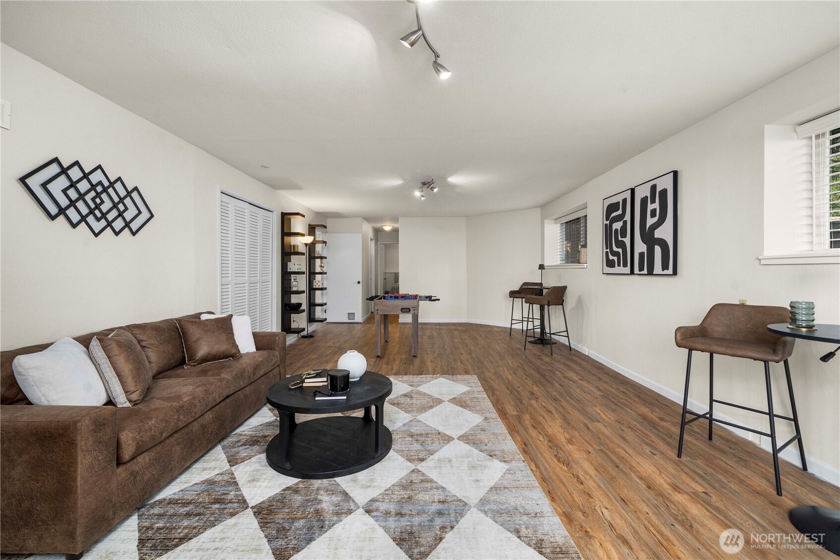31611 37th Avenue Southwest Federal Way, WA 98023 - Photo 24 of 34 a living room with furniture and a wooden floor