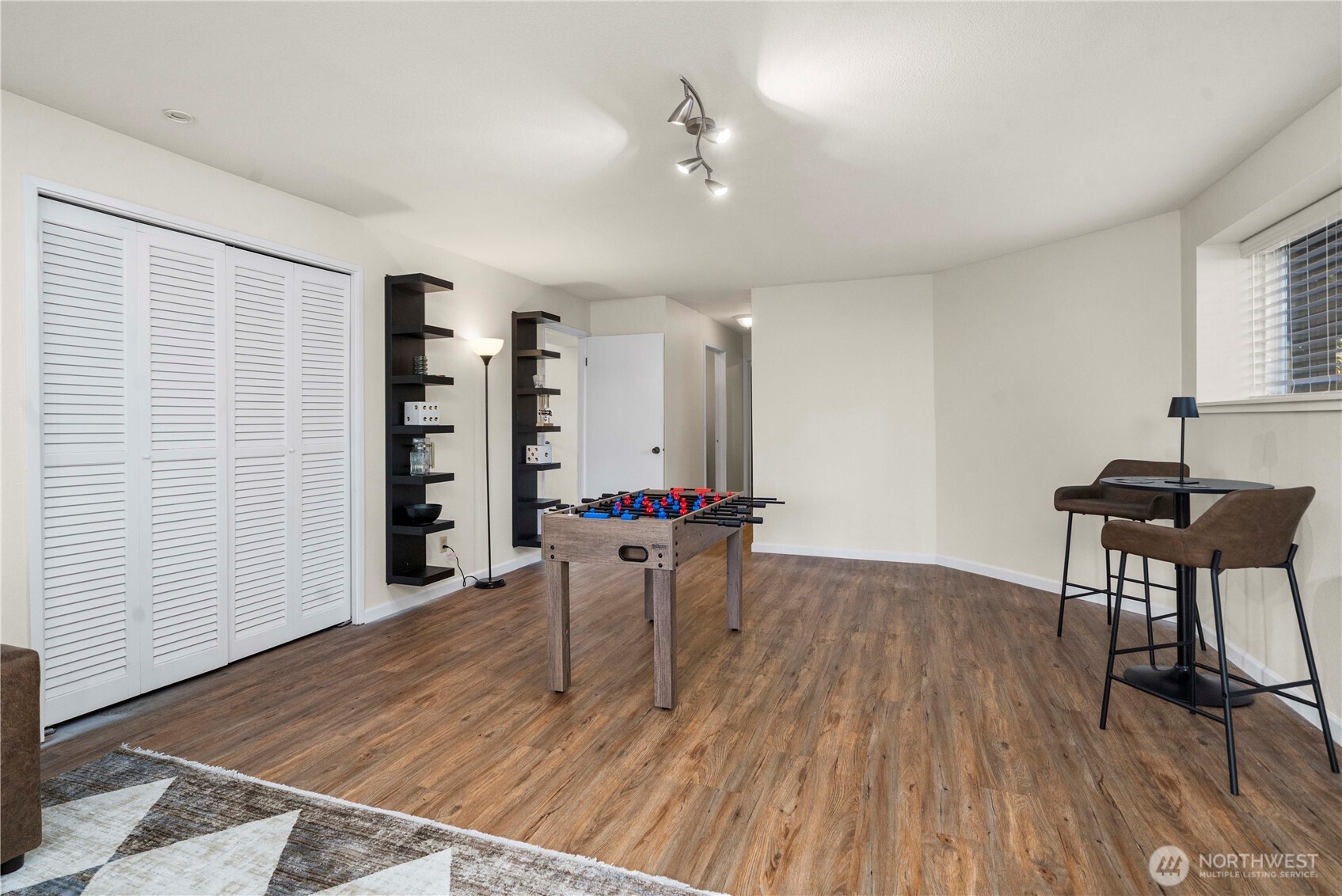 31611 37th Avenue Southwest Federal Way, WA 98023 - Photo 27 of 34 a room with furniture and wooden floor