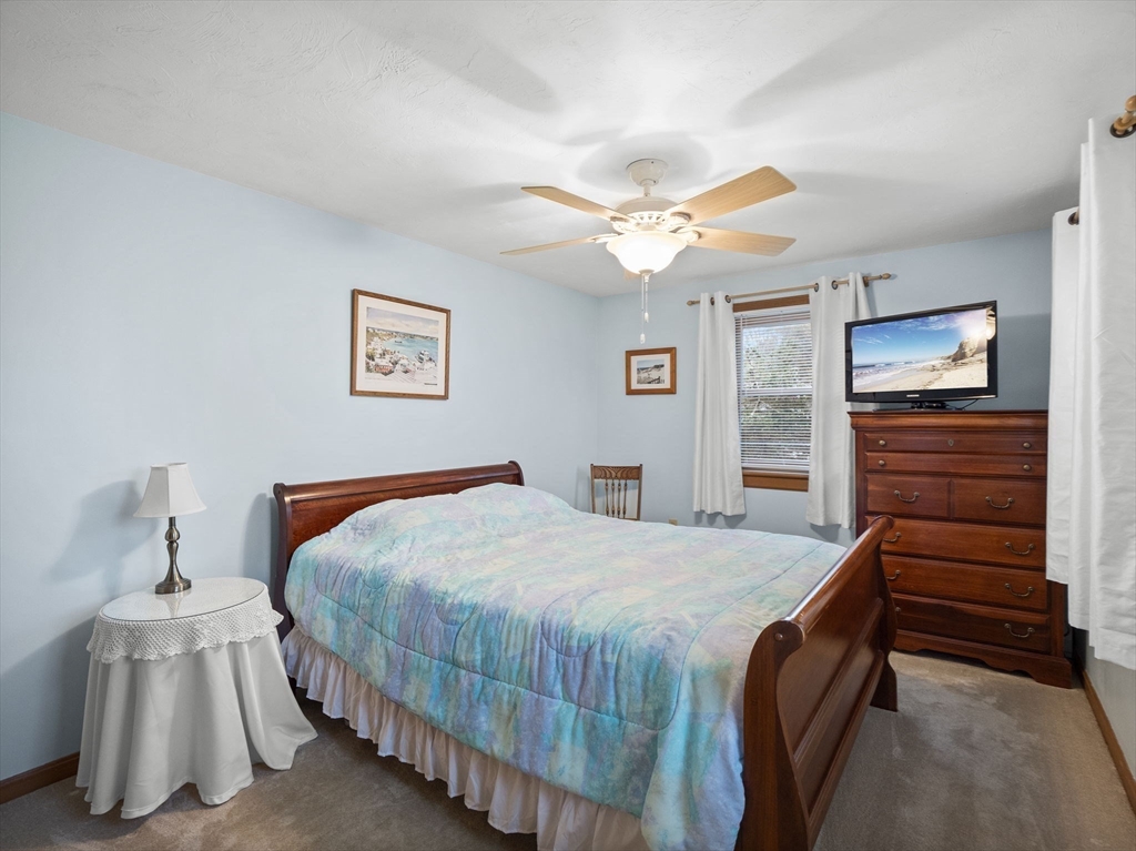 16 Blueberry Road Ashburnham, MA 01430 - Photo 16 of 42 a bedroom with a bed and a chandelier