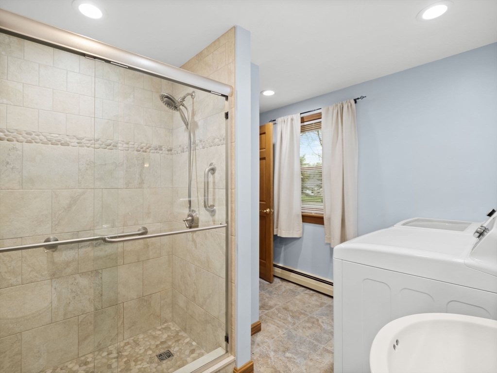 16 Blueberry Road Ashburnham, MA 01430 - Photo 19 of 42 a bathroom with a shower a sink and a toilet