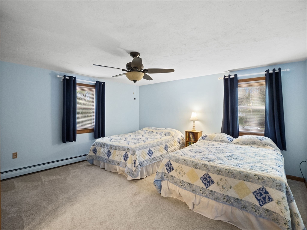 16 Blueberry Road Ashburnham, MA 01430 - Photo 22 of 42 a bedroom with two beds and large windows