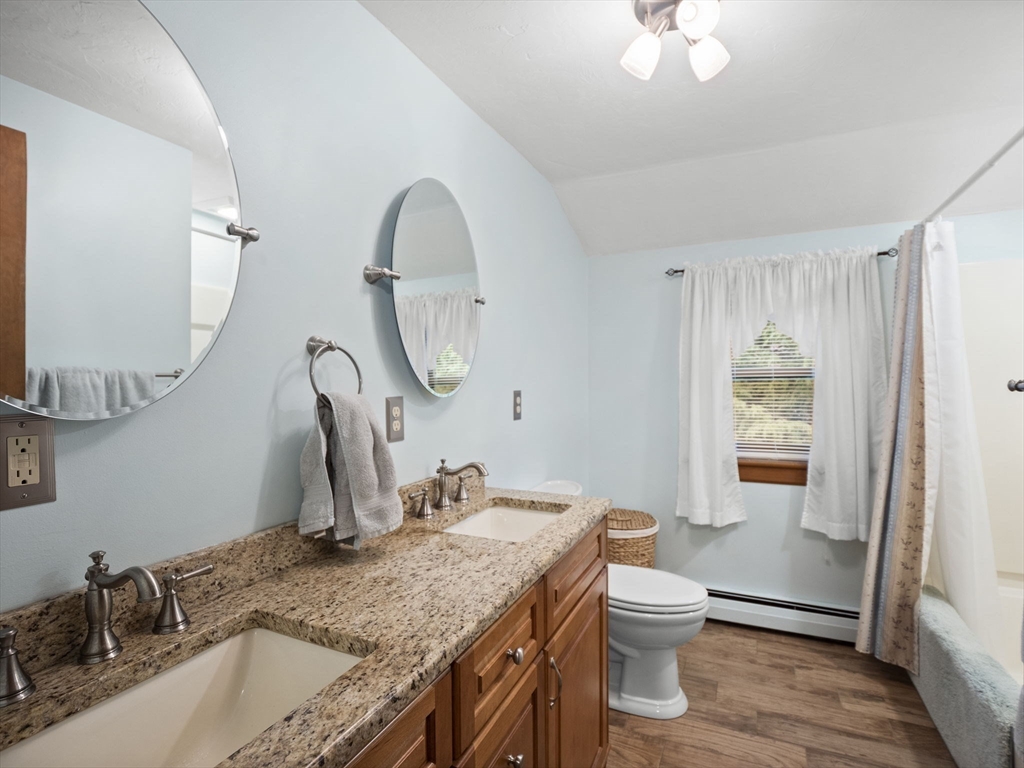 16 Blueberry Road Ashburnham, MA 01430 - Photo 23 of 42 a bathroom with a granite countertop sink a toilet and a mirror