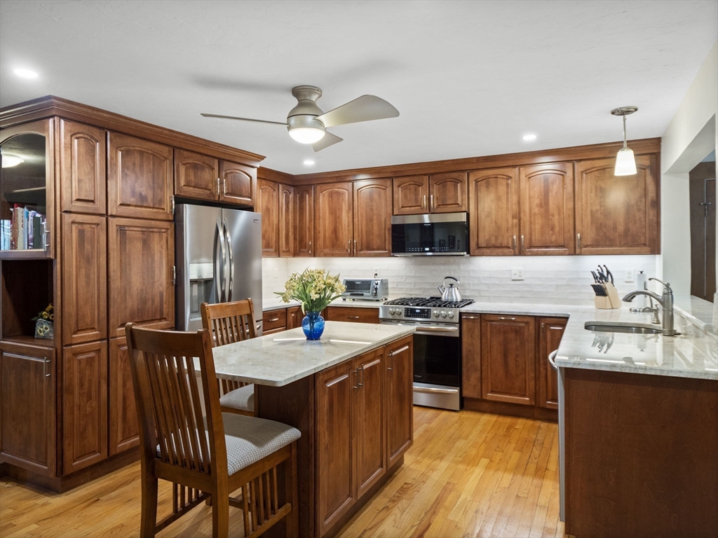 16 Blueberry Road Ashburnham, MA 01430 - Photo 7 of 42 a kitchen with stainless steel appliances granite countertop a refrigerator stove microwave and sink