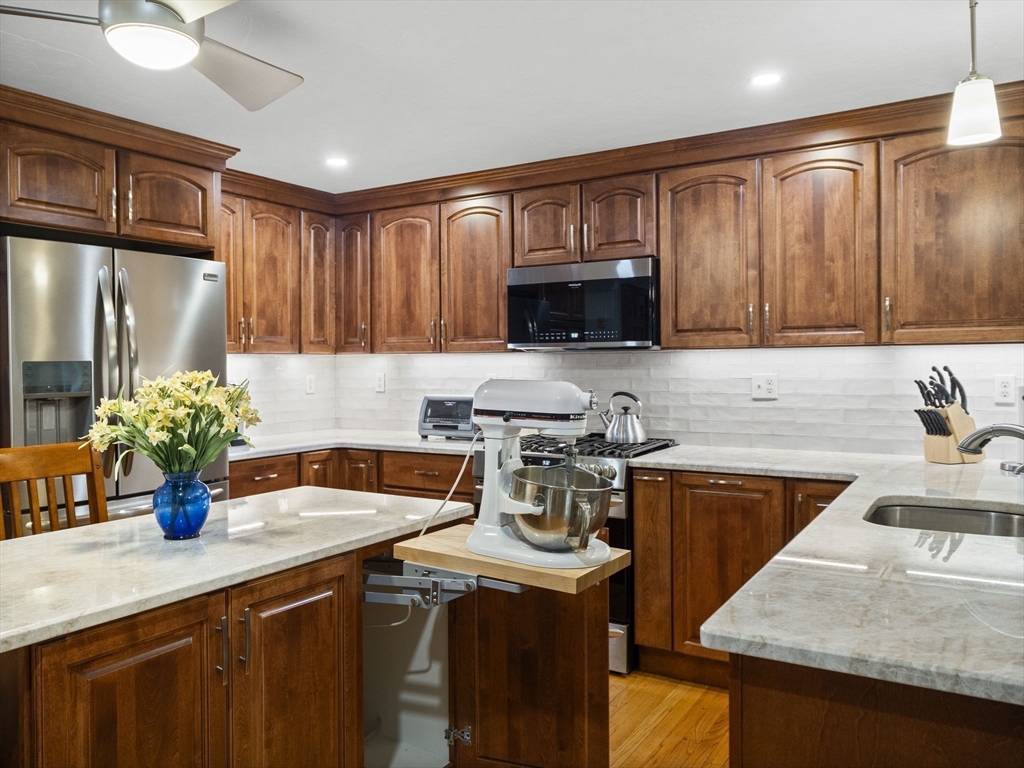16 Blueberry Road Ashburnham, MA 01430 - Photo 10 of 42 a kitchen with a sink a stove cabinets and a counter top space