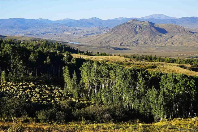 a view of a area with mountains in the background