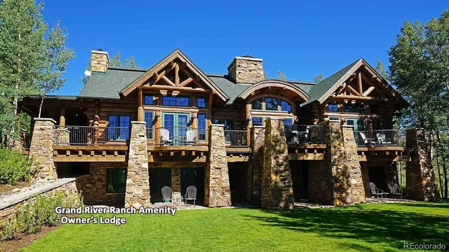 a living room with furniture ceiling fan and a window