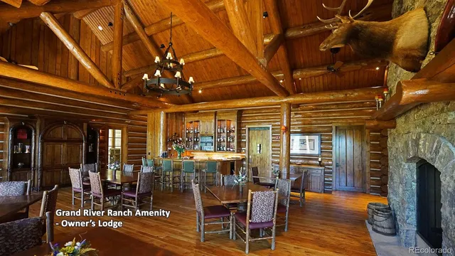a living room with furniture a fireplace and a table