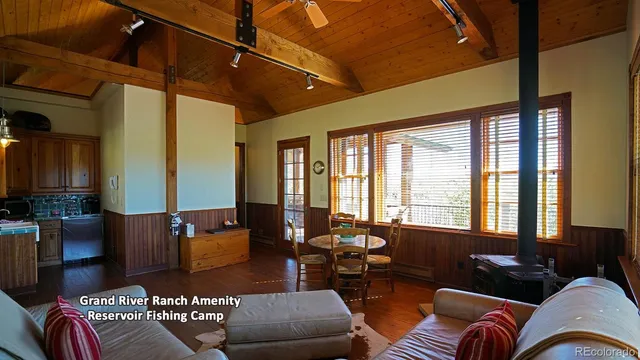 a bedroom with furniture and a window