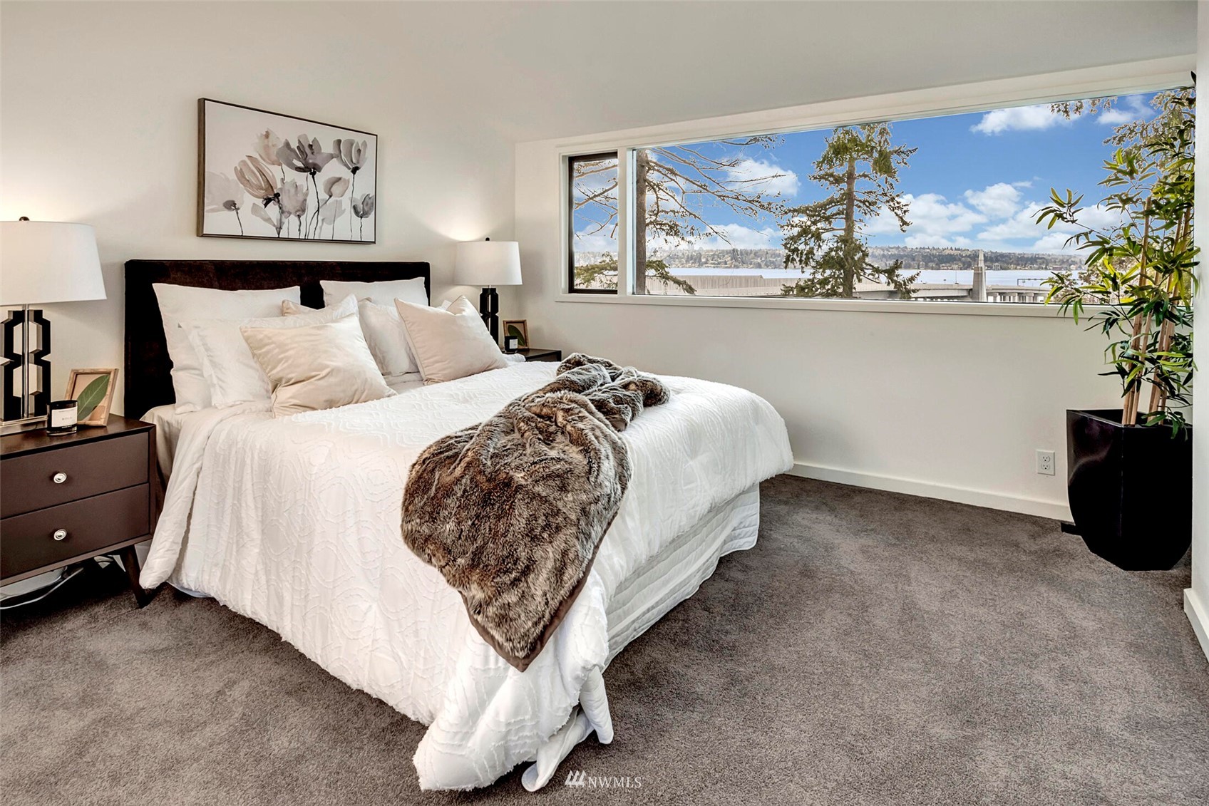 3217 Evergreen Point Road Medina, WA 98039 - Photo 12 of 25 a bed room with a bed and painting on the wall