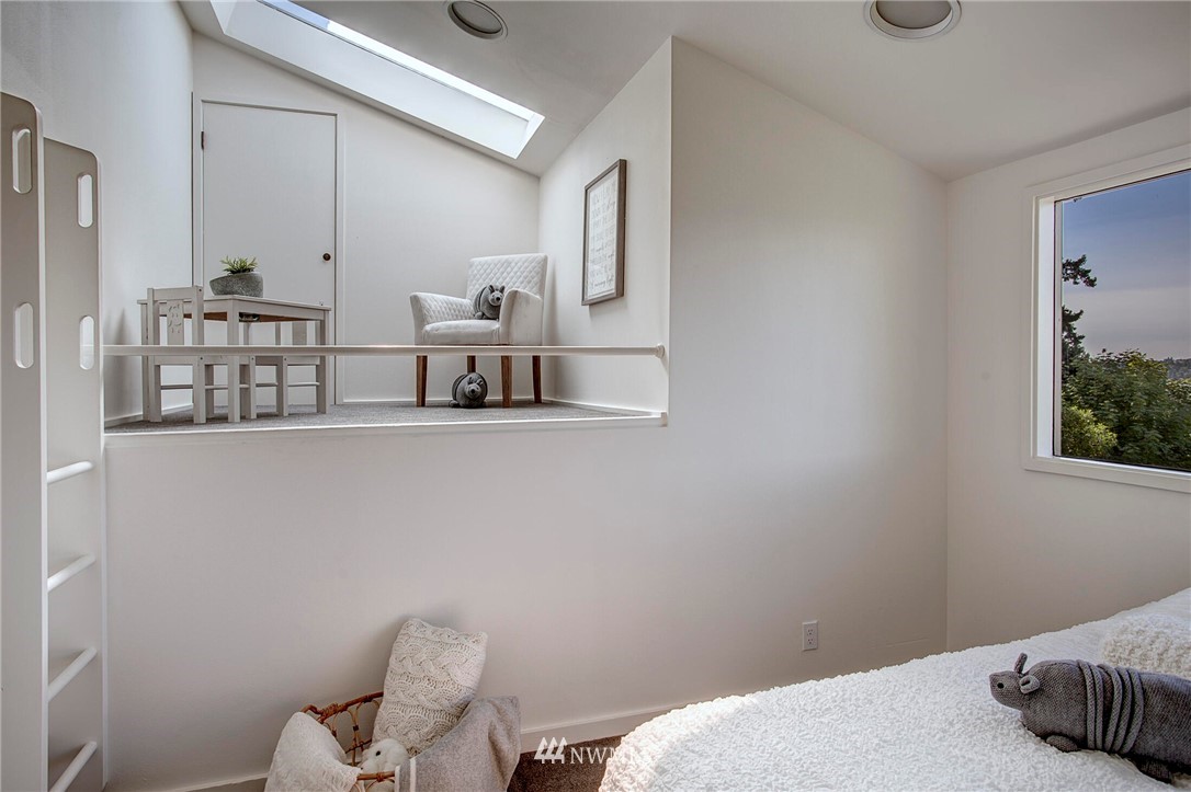 3217 Evergreen Point Road Medina, WA 98039 - Photo 16 of 25 a bedroom with a bed and chair