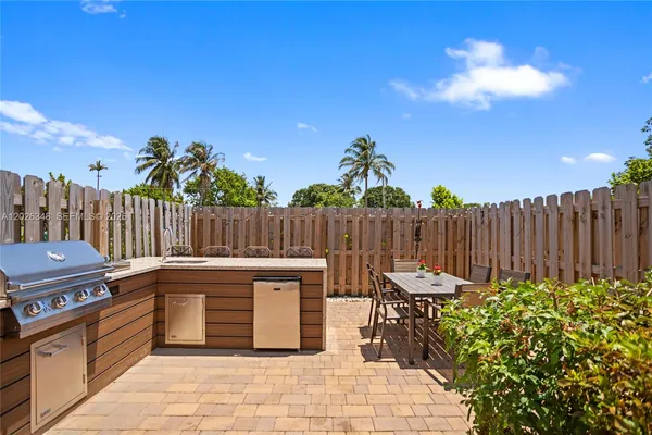 a view of a backyard with sitting area