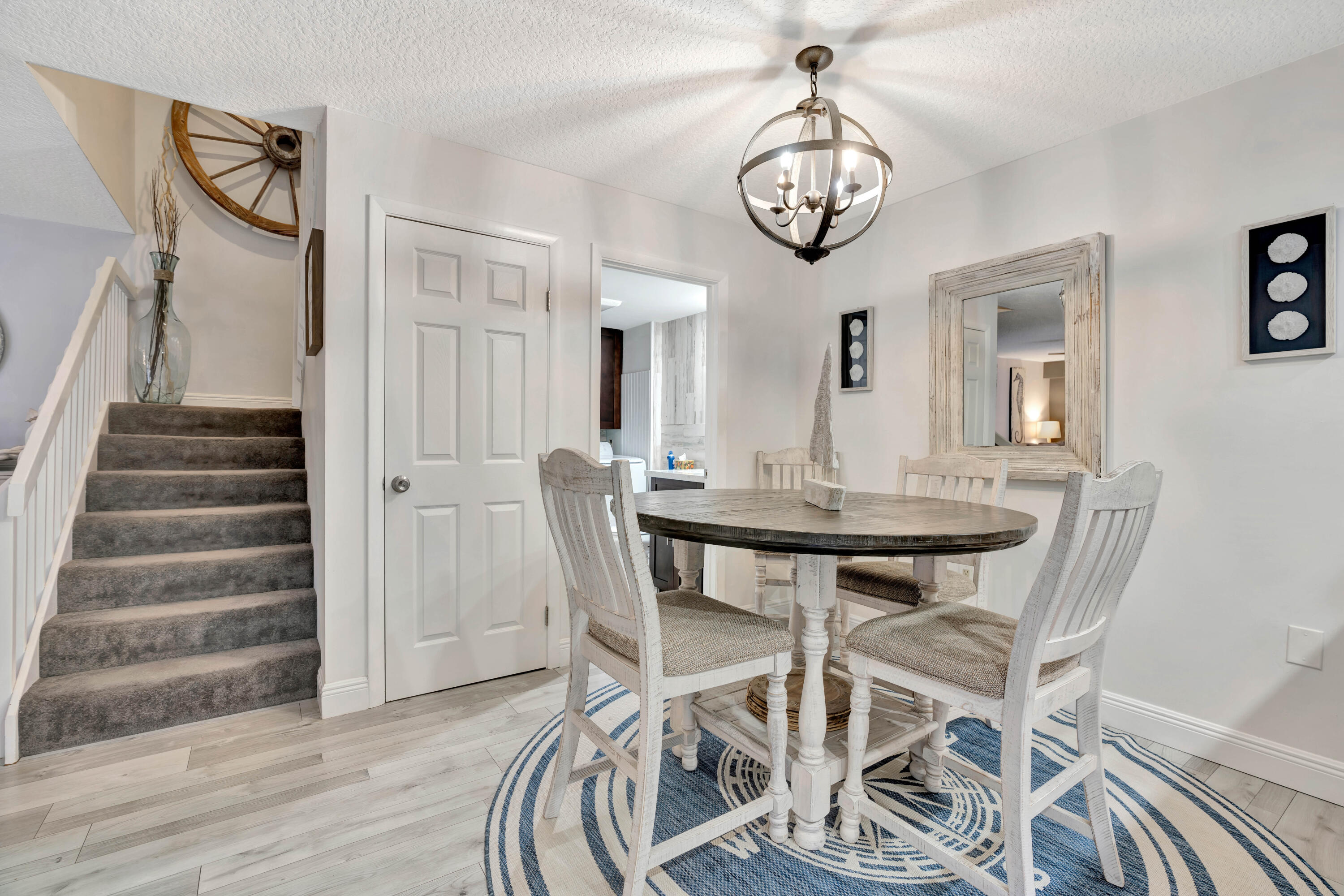 1209 12th Court Jupiter, FL 33477 - Photo 12 of 31 a view of a dining room with furniture and wooden floor
