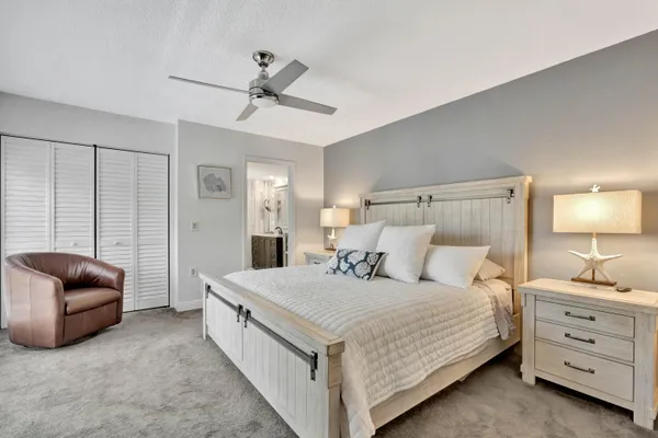 a bedroom with a bed and a couch