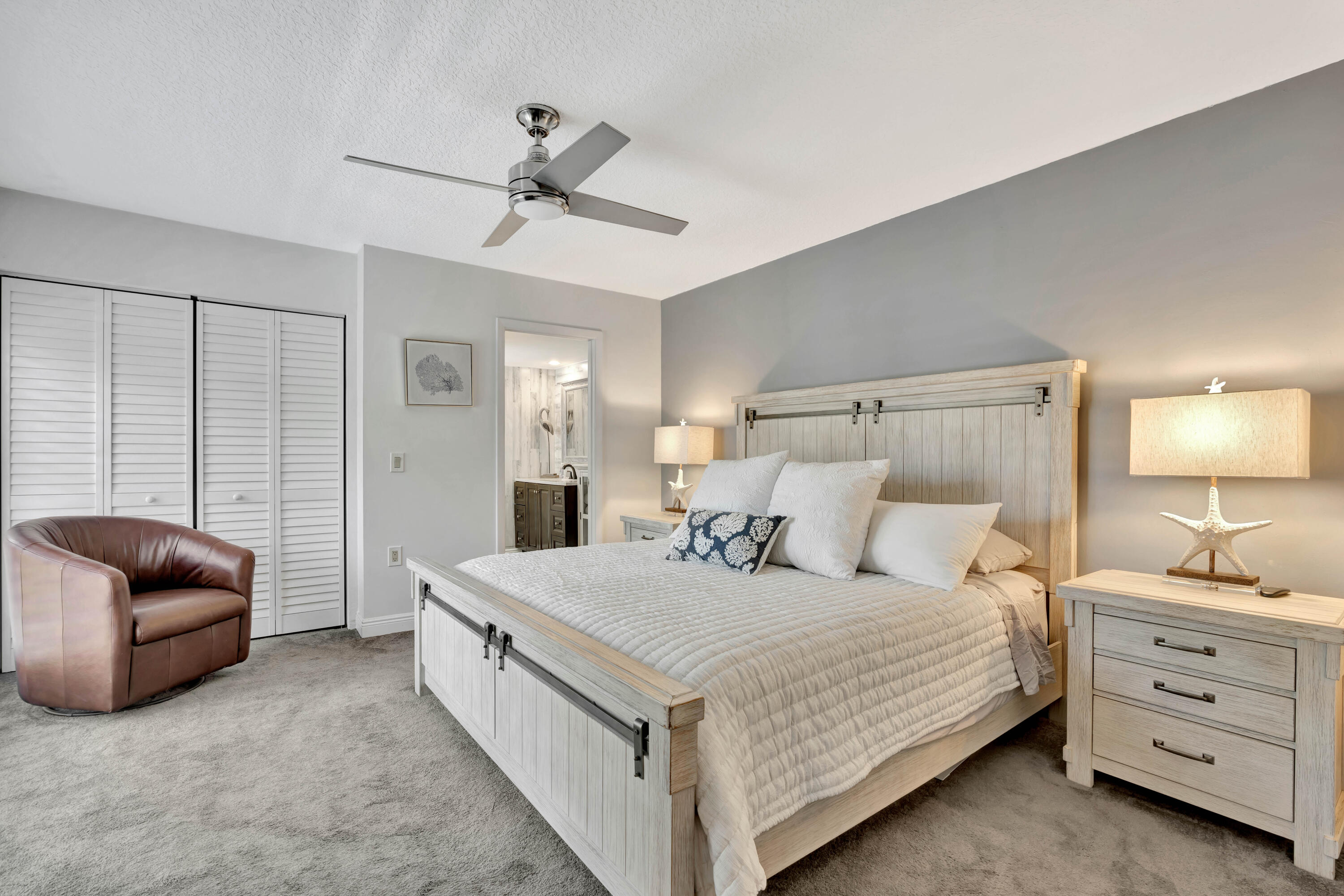 1209 12th Court Jupiter, FL 33477 - Photo 20 of 31 a bedroom with a bed and a couch