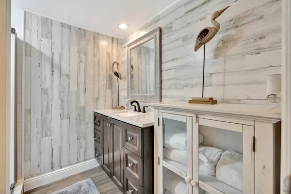 a bathroom with a double vanity sink and a mirror