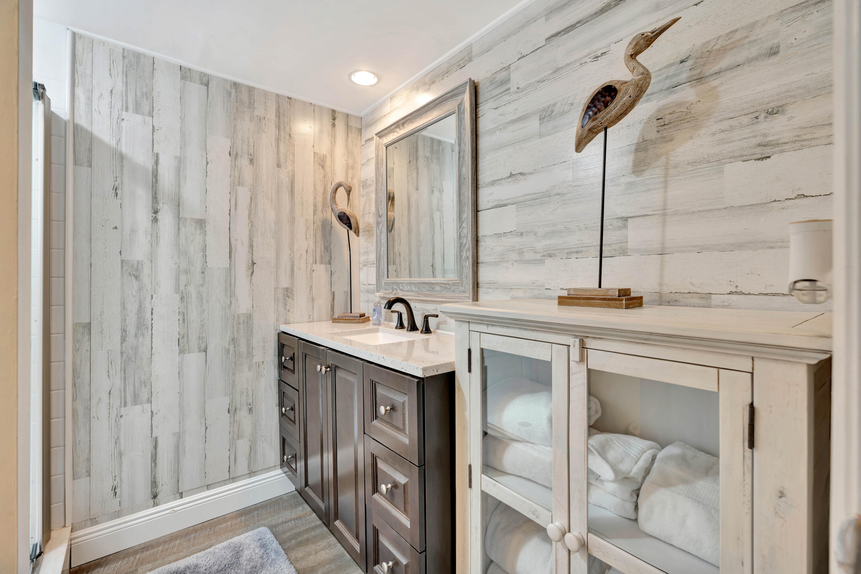 1209 12th Court Jupiter, FL 33477 - Photo 24 of 31 a bathroom with a double vanity sink and a mirror