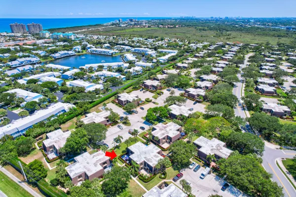 an aerial view of residential houses with outdoor space and street view