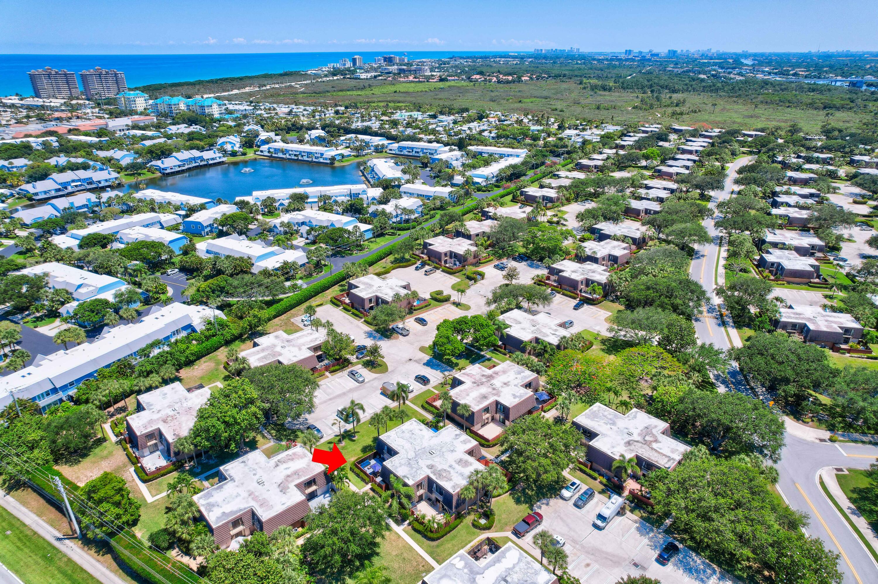 1209 12th Court Jupiter, FL 33477 - Photo 28 of 31 an aerial view of residential houses with outdoor space and street view