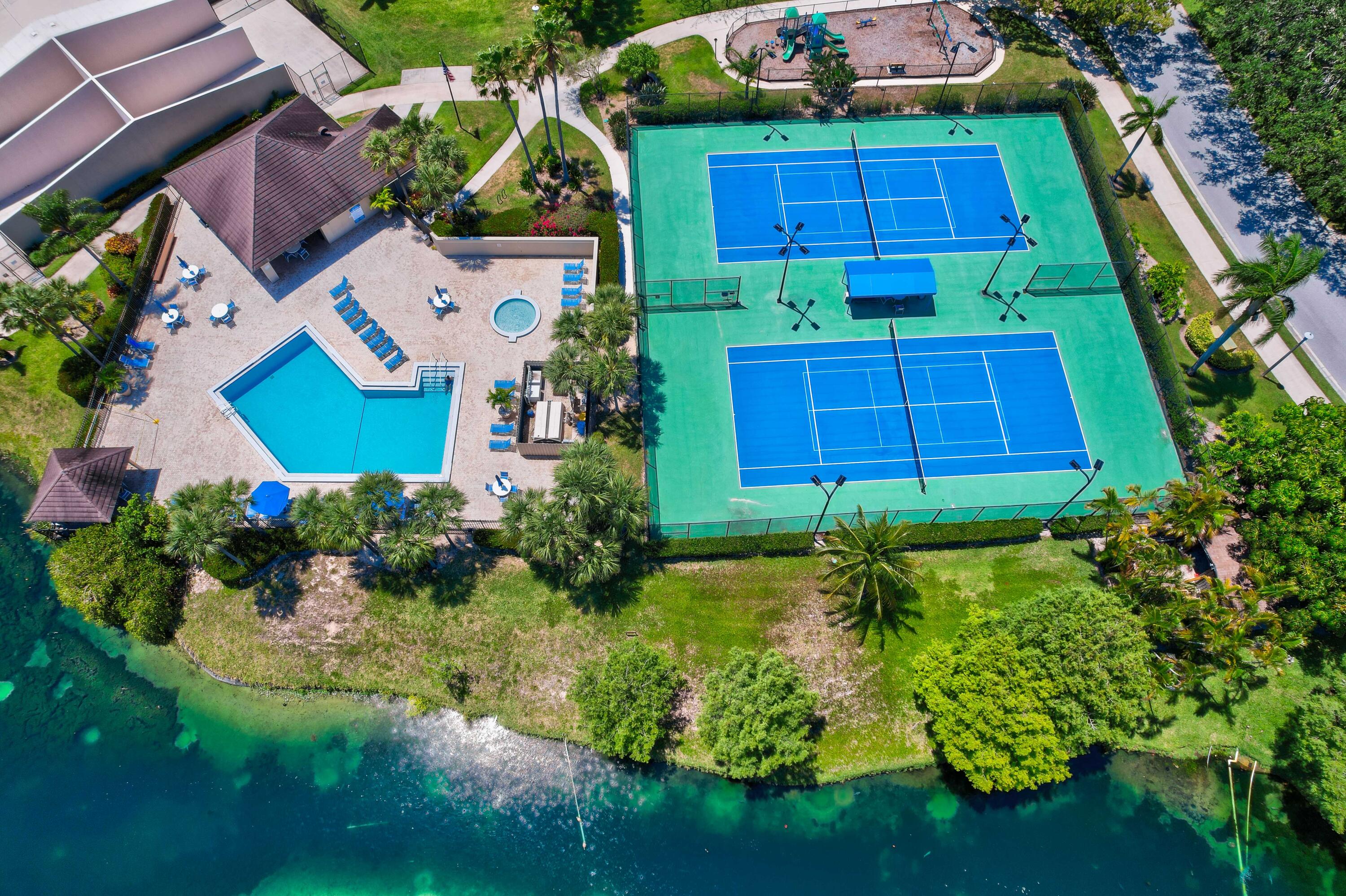 1209 12th Court Jupiter, FL 33477 - Photo 29 of 31 a view of a garden with plants and large trees