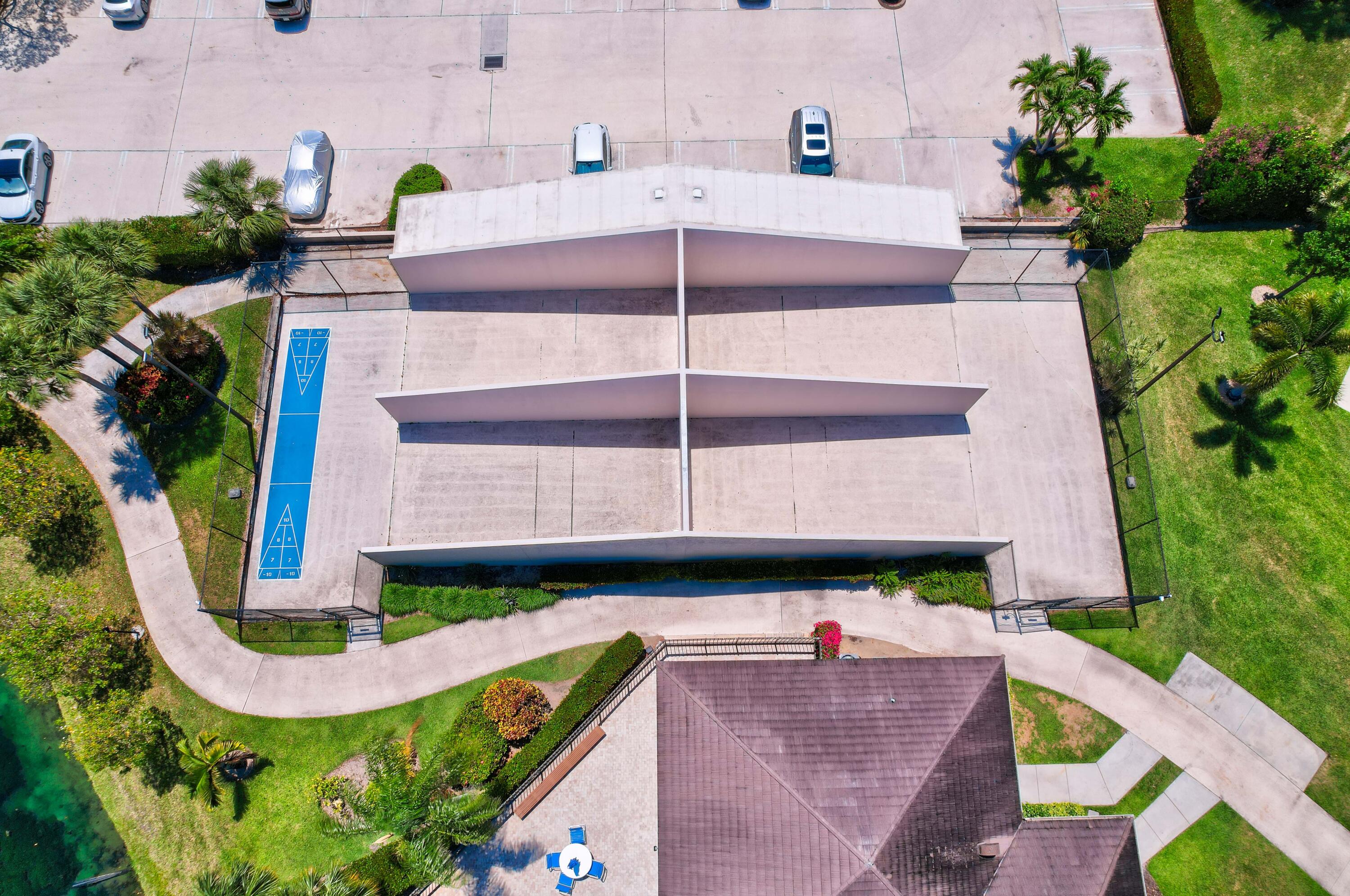 1209 12th Court Jupiter, FL 33477 - Photo 31 of 31 an aerial view of a multi story residential apartment building with a yard