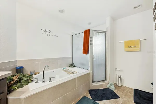 a bathroom with a bathtub and a sink
