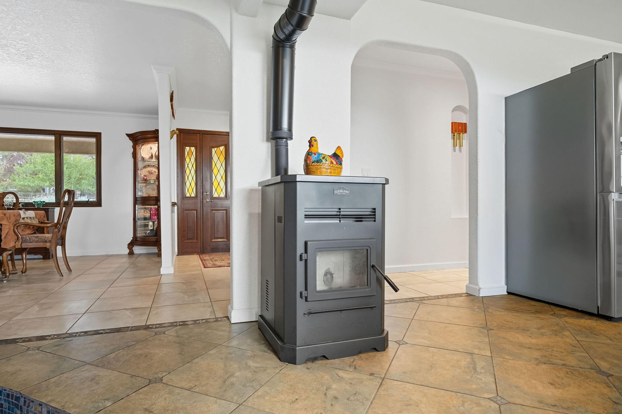 28382 Alpine Way Shingletown, CA 96088 - Photo 13 of 45 a kitchen with a refrigerator and table chair