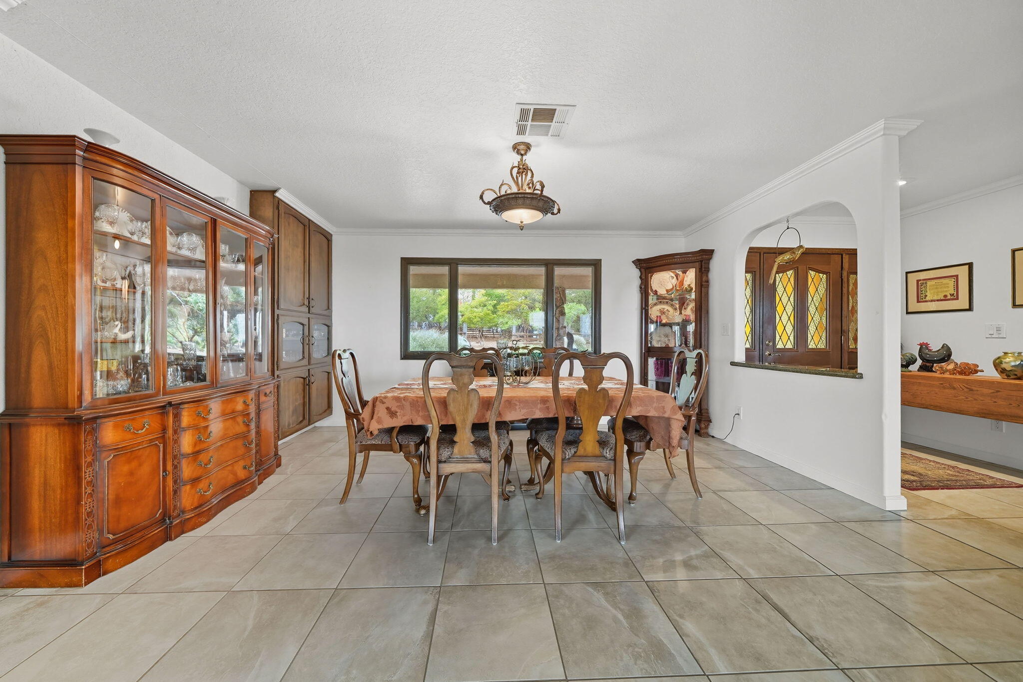 28382 Alpine Way Shingletown, CA 96088 - Photo 15 of 45 a dining room with furniture windows and a chandelier