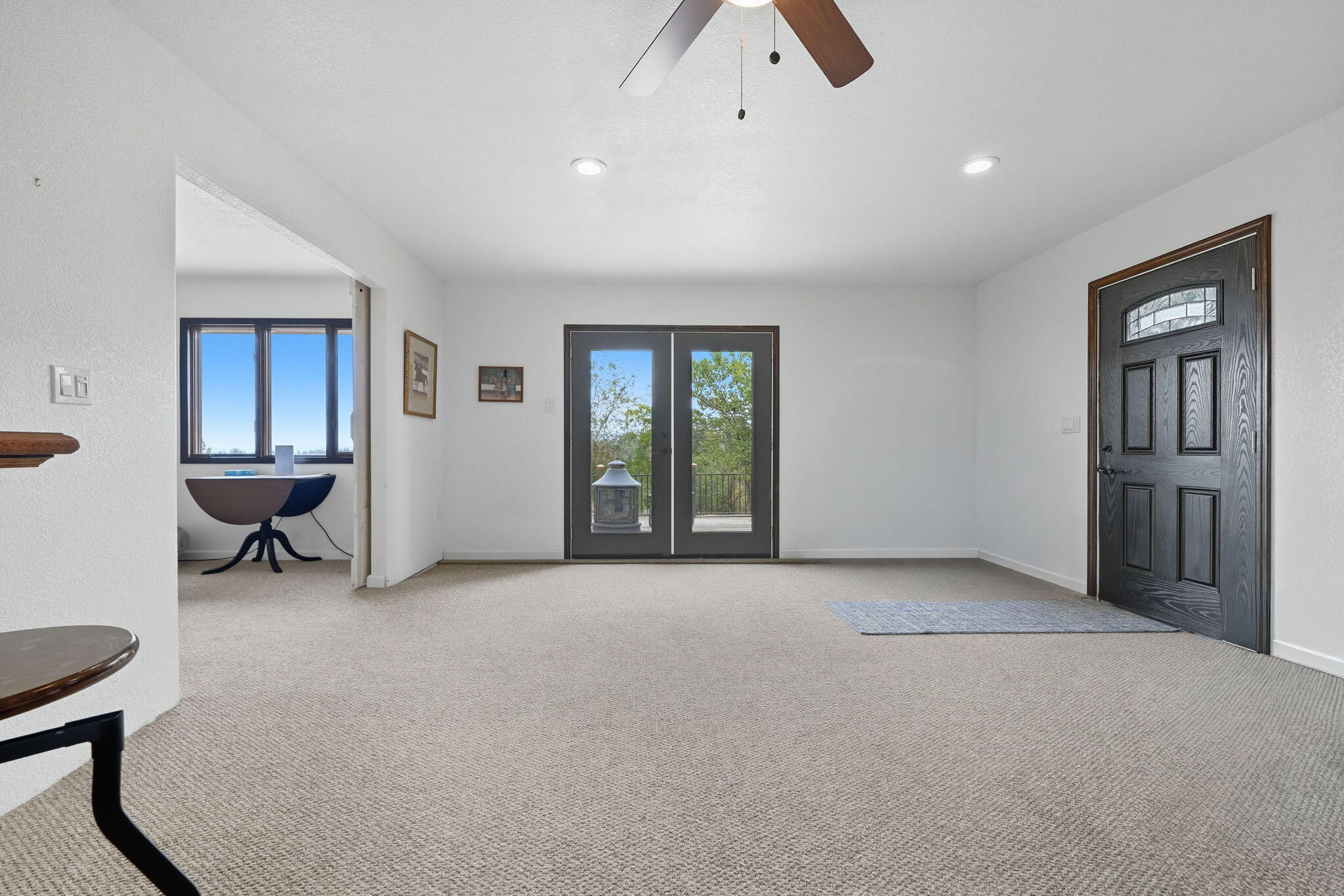 28382 Alpine Way Shingletown, CA 96088 - Photo 20 of 45 a view of an empty room with glass door and a window