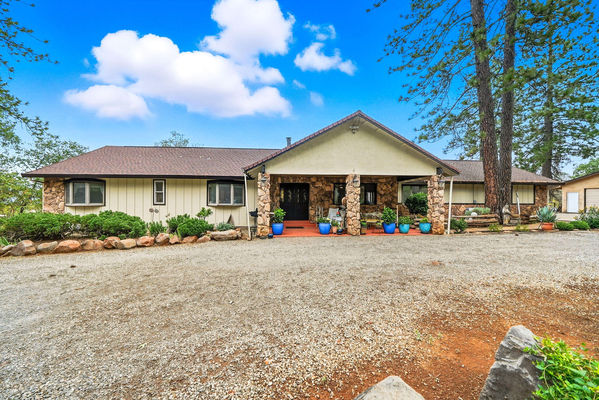28382 Alpine Way Shingletown, CA 96088 - Photo 2 of 45 a front view of a house with garden