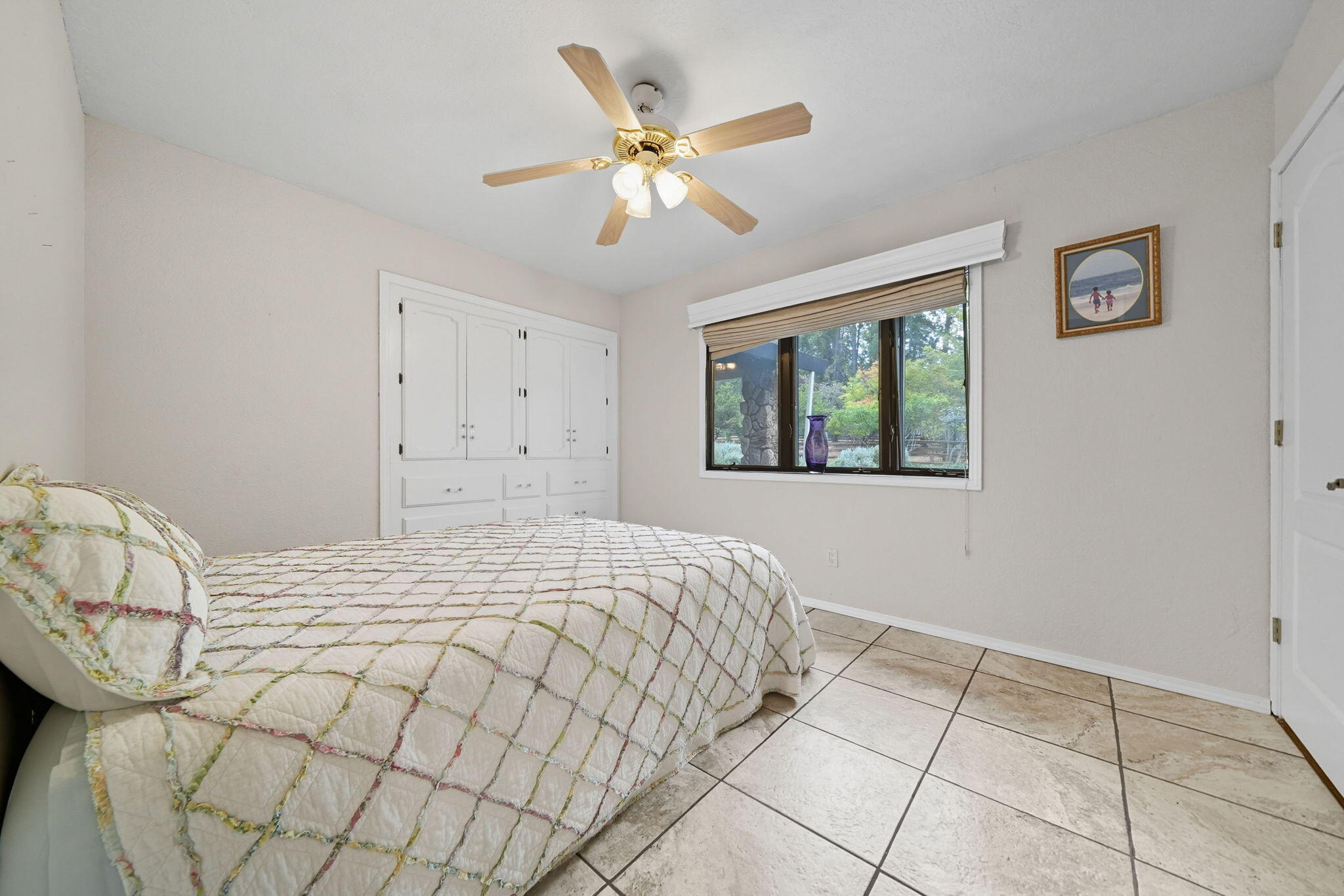 28382 Alpine Way Shingletown, CA 96088 - Photo 22 of 45 a bedroom with a bed and a window