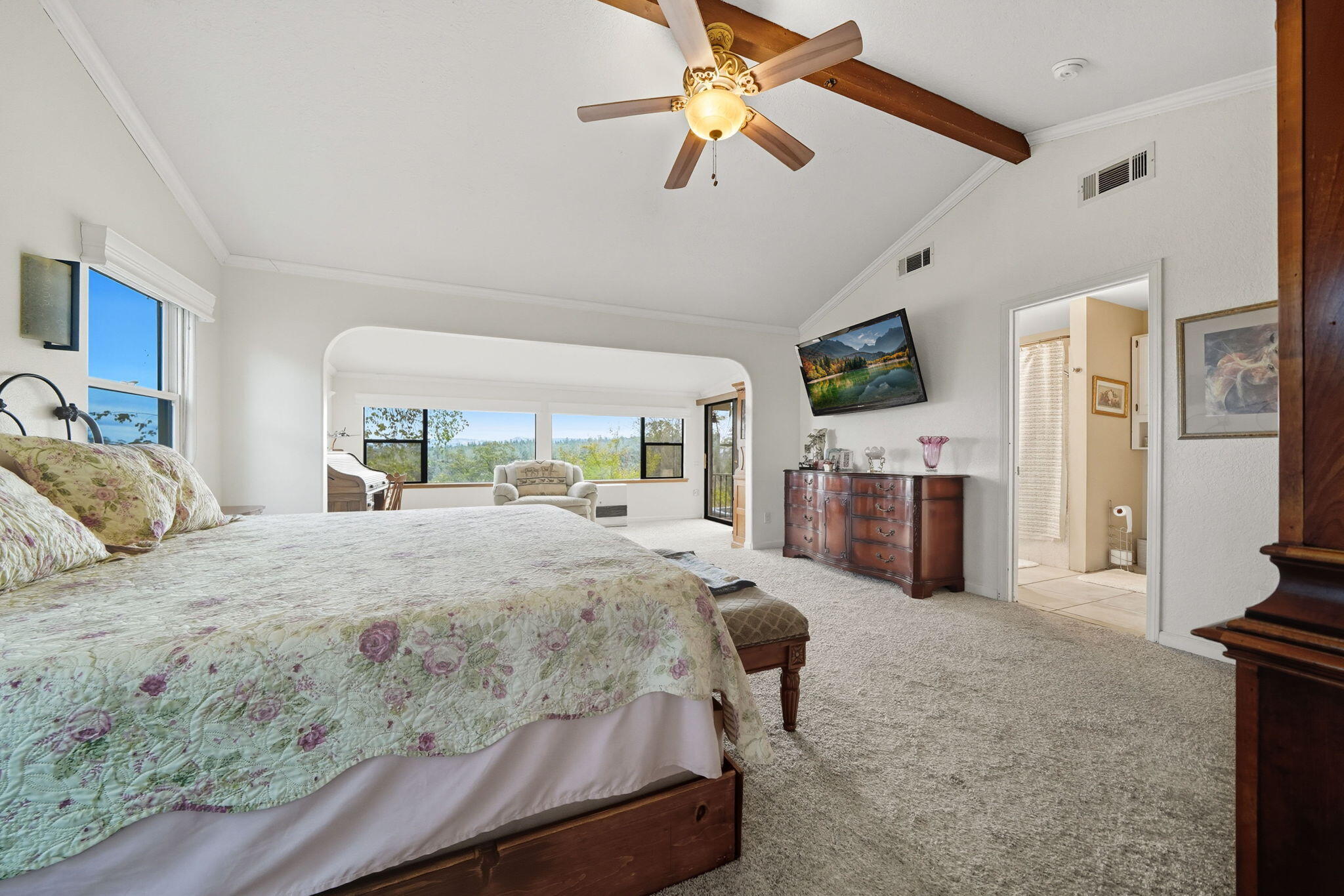 28382 Alpine Way Shingletown, CA 96088 - Photo 28 of 45 a bedroom with a bed couch and a flat tv screen