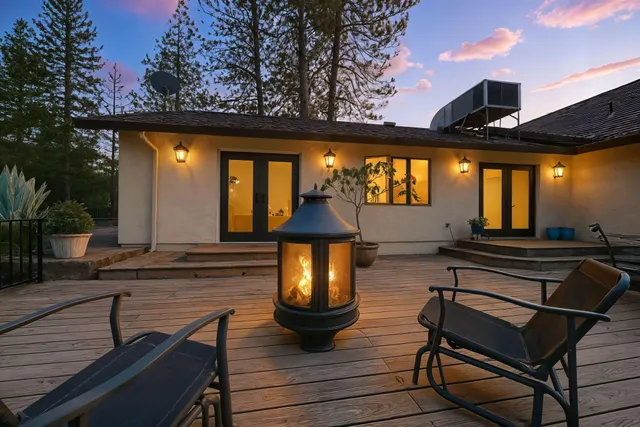 a view of a chairs and table in the patio
