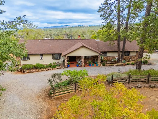a house with trees in the background