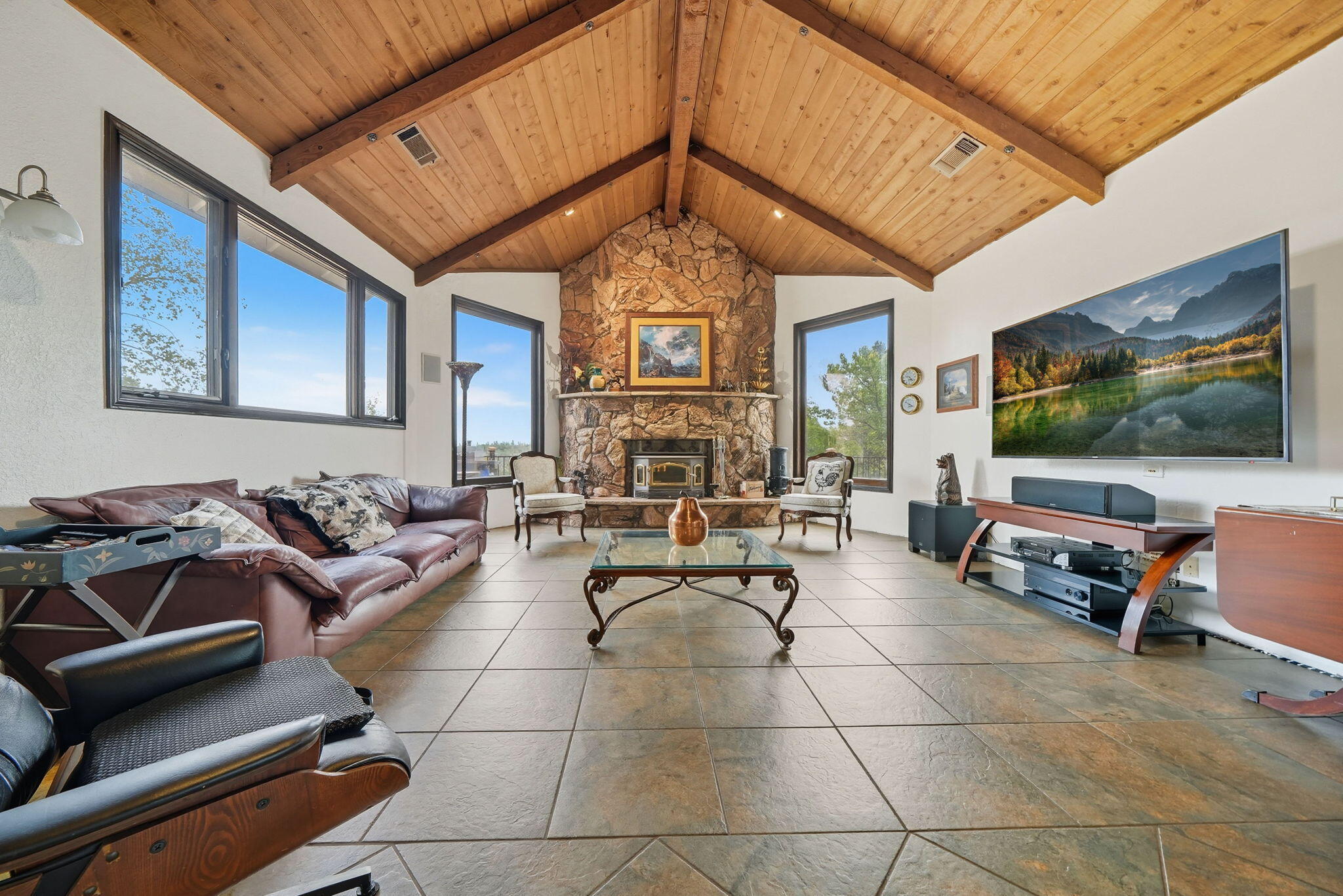28382 Alpine Way Shingletown, CA 96088 - Photo 5 of 45 a living room with furniture a flat screen tv and couches