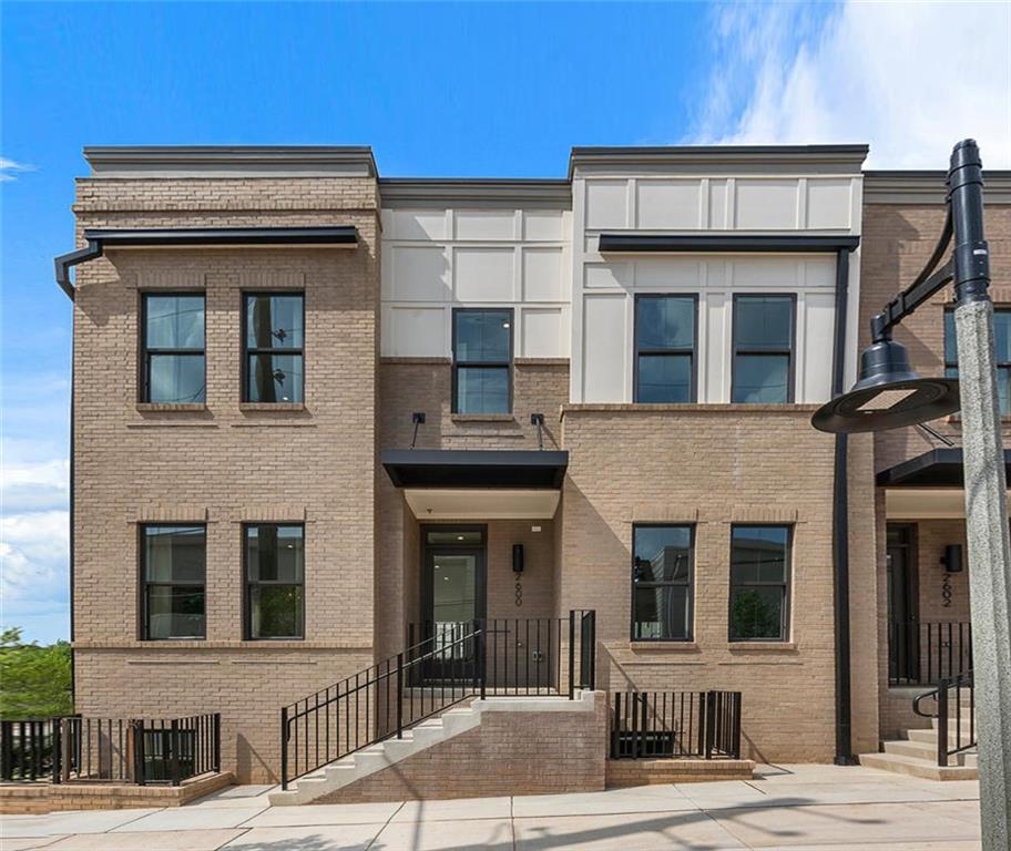 209 New Street, Unit 25 Decatur, GA 30030 - Photo 1 of 1 a building view that has a sign on it