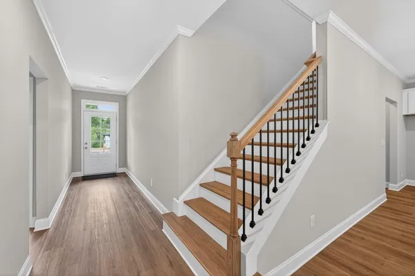a view of entryway with wooden floor