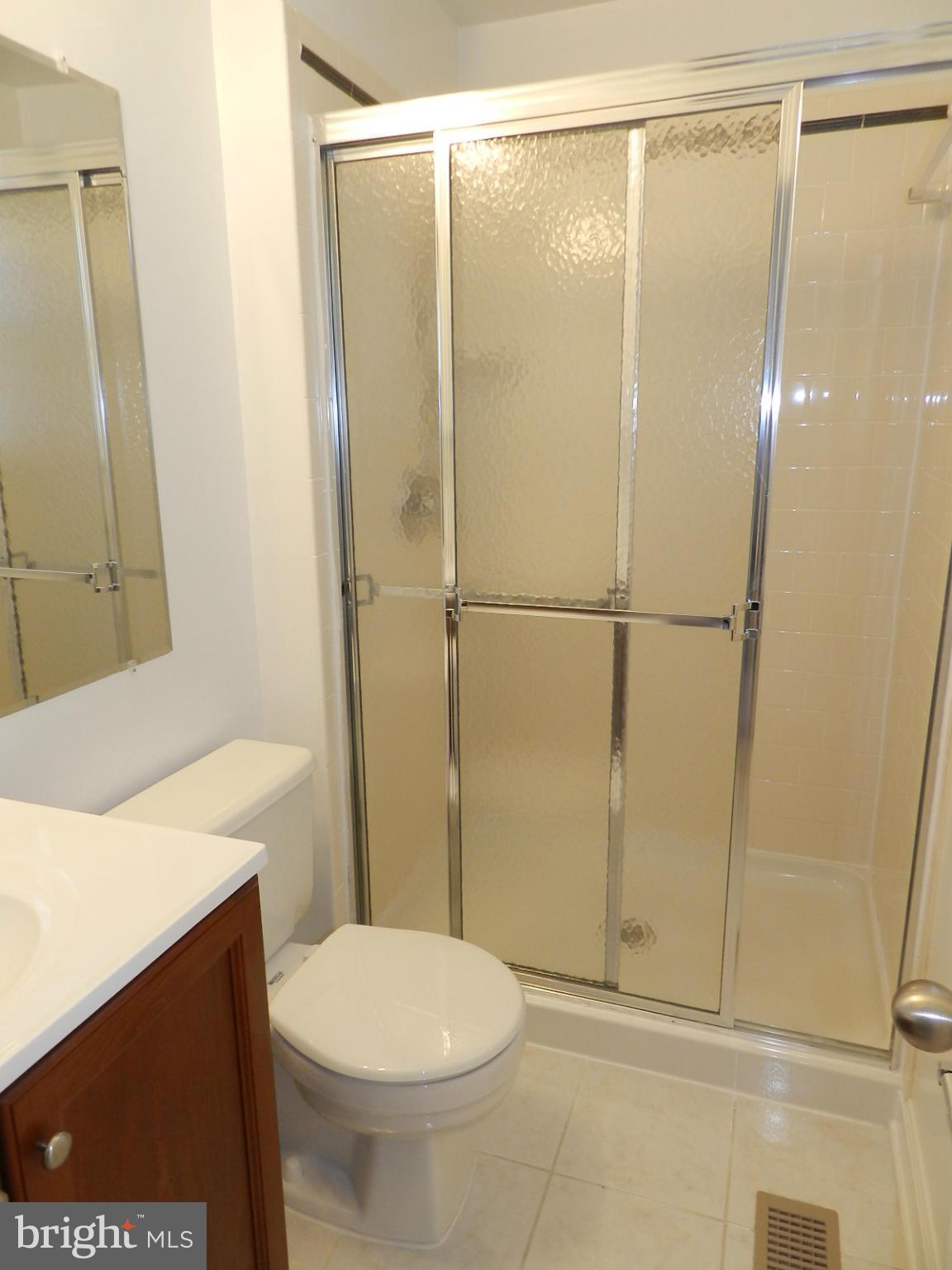 932 Pointer Ridge Drive Gaithersburg, MD 20878 - Photo 22 of 29 a bathroom with a shower and a toilet