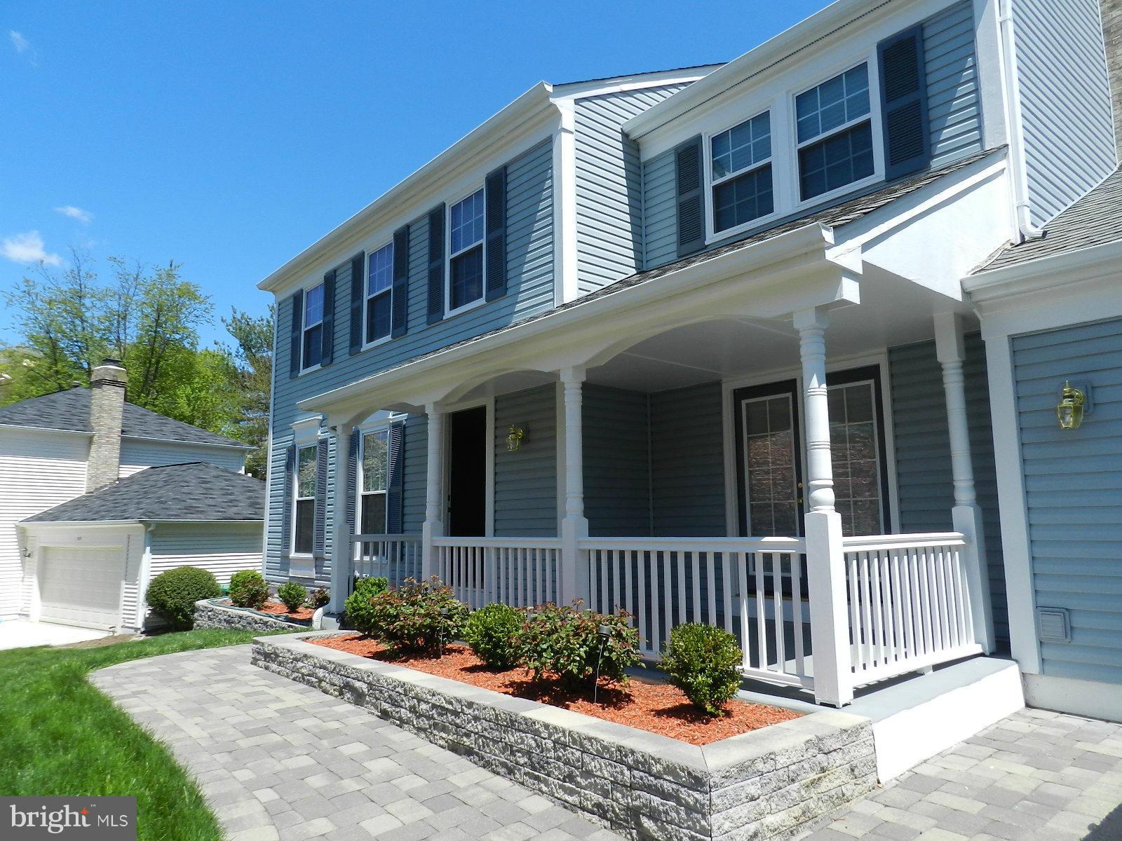 932 Pointer Ridge Drive Gaithersburg, MD 20878 - Photo 4 of 29 a front view of a house with a garden