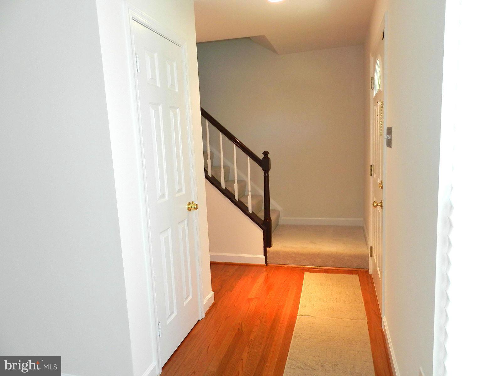 932 Pointer Ridge Drive Gaithersburg, MD 20878 - Photo 5 of 29 a view of a hallway with wooden floor