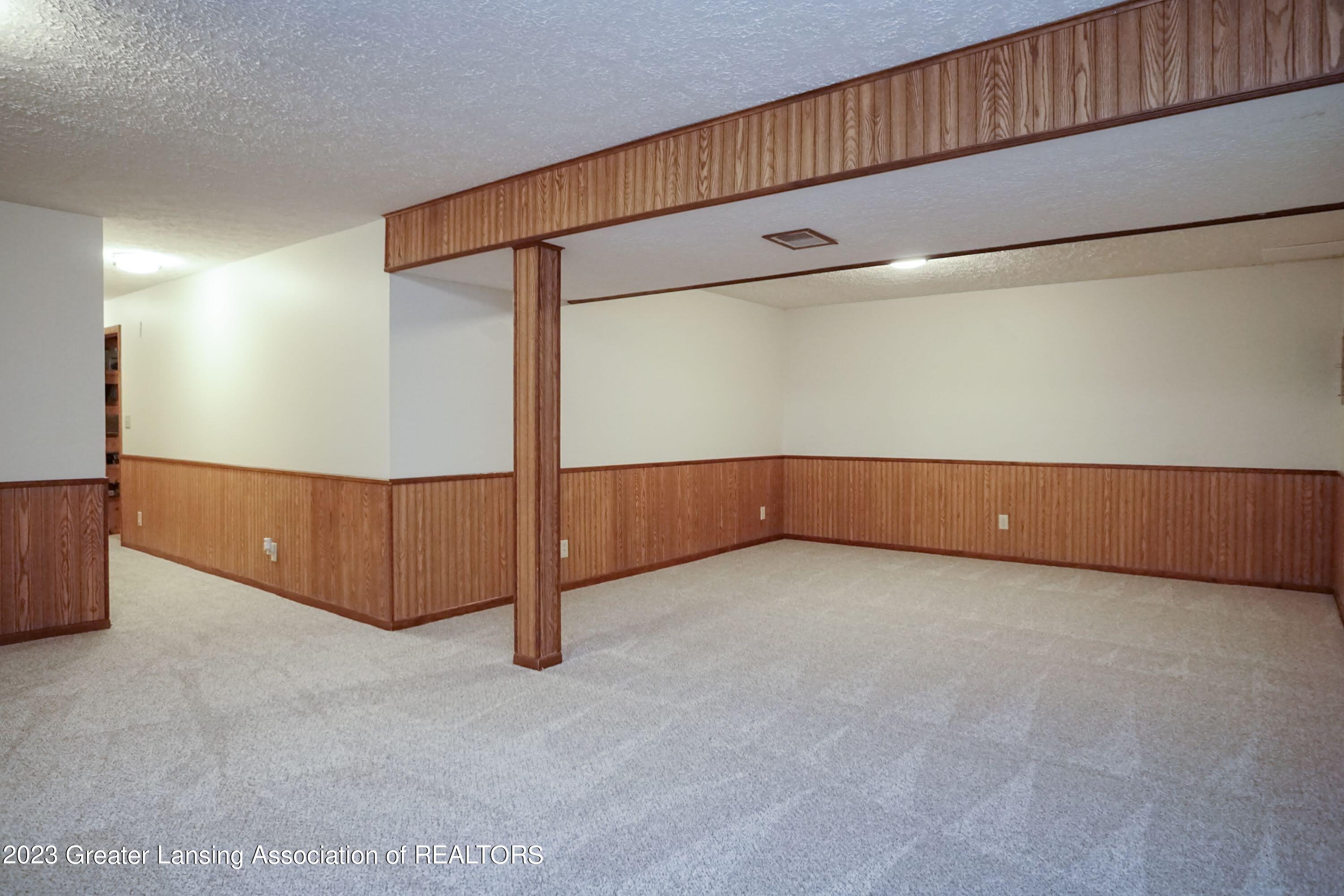 5872 Green Road Haslett, MI 48840 - Photo 20 of 31 Rec Area Basement